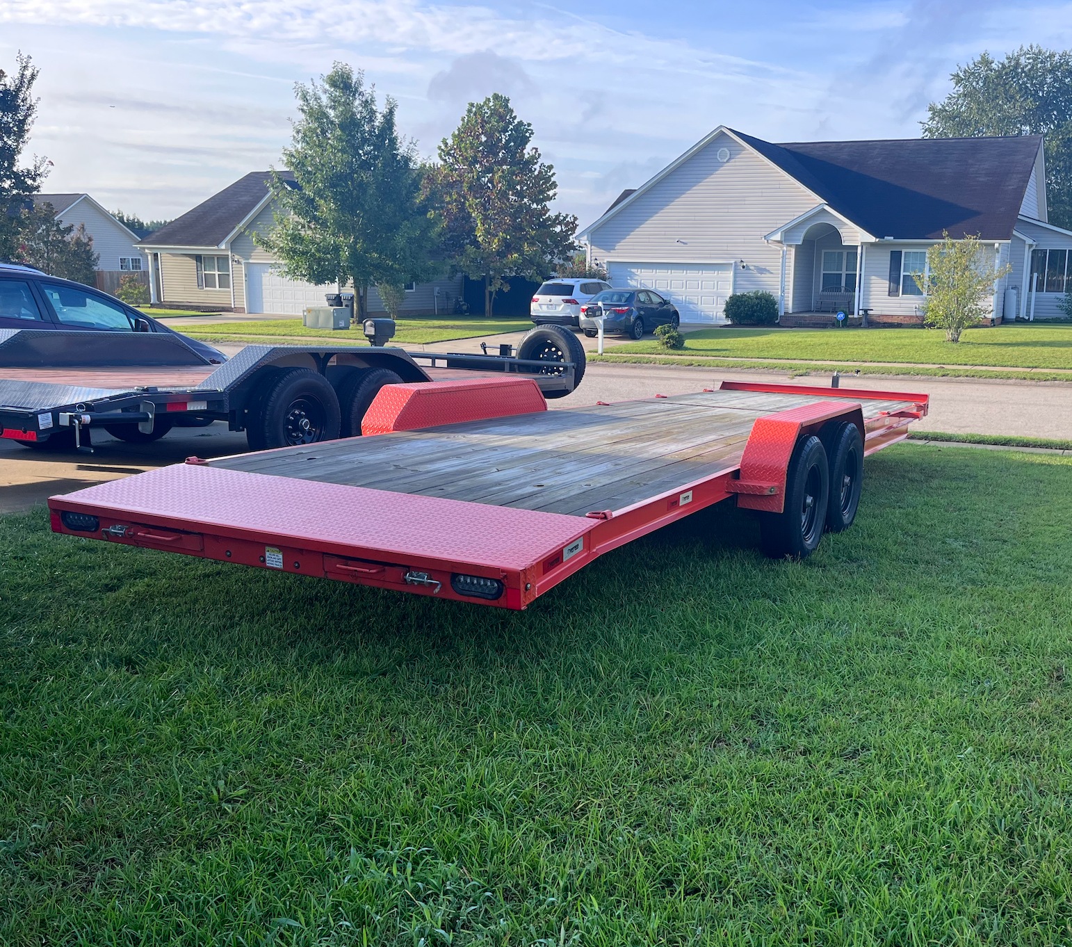 83 inch x 26 foot Southern Utility car hauler trailer rental in Raeford, NC — driver side rear angle with wood deck